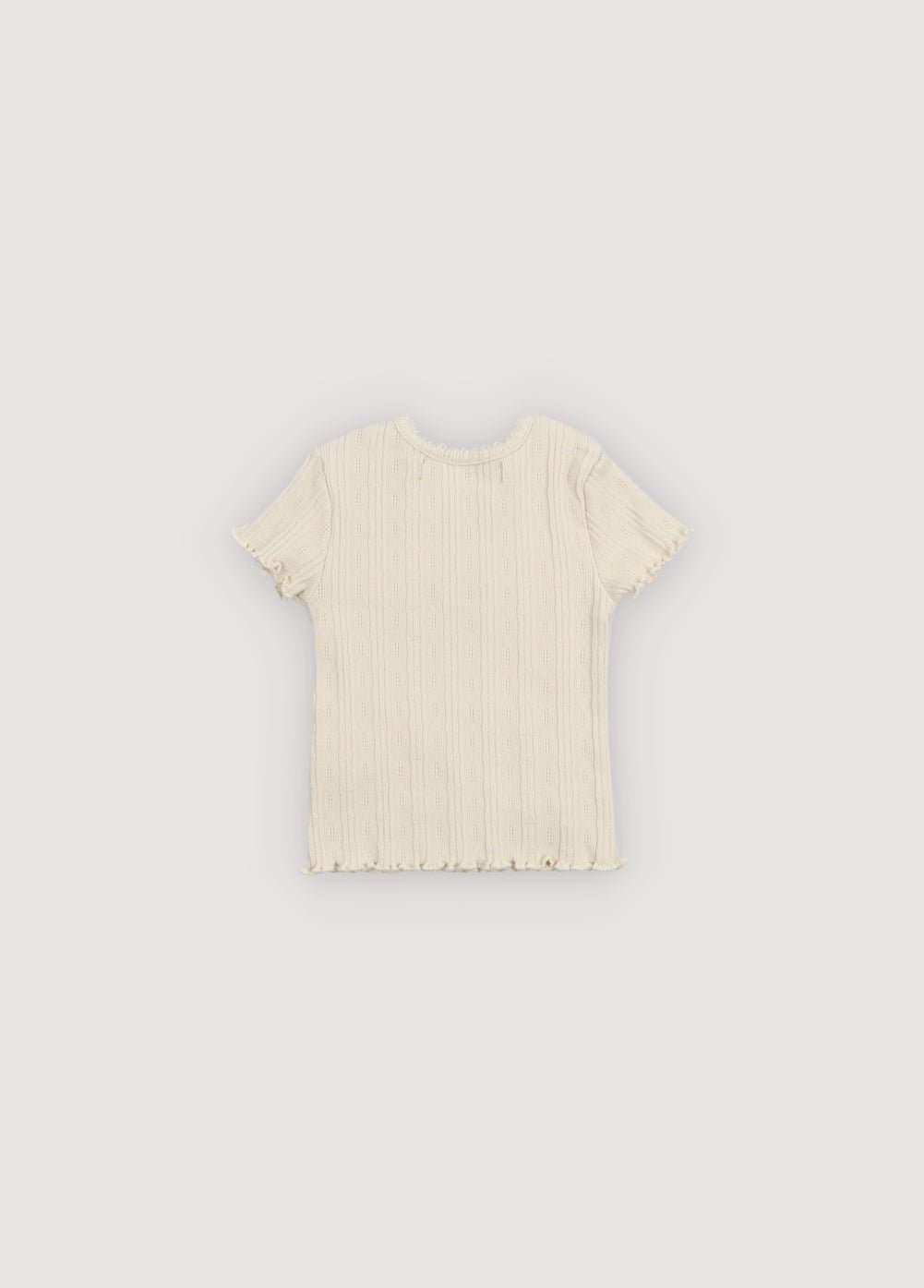 Soft jersey tee featuring a delicate openwork design that adds a special touch.