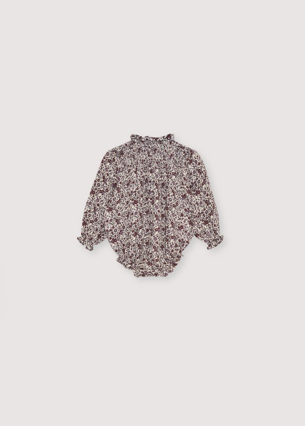 美しい花柄のダブルガーゼ品質のベビーロンパース。ネックラインの伸縮性のあるディテールと小さなフリルトリムが特徴です。