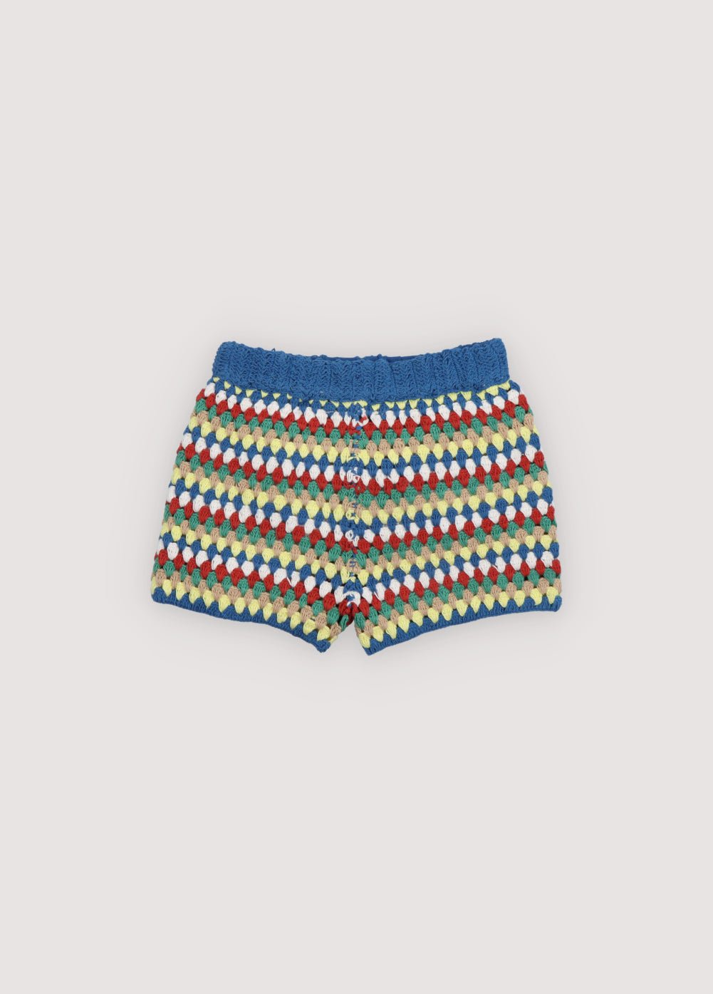 Crochet shorts with colorful stripes and ribbed elastic waistband. It comes with a jumper and a bucket hat to create a total look. Spring Summer Collection. The New Society. 