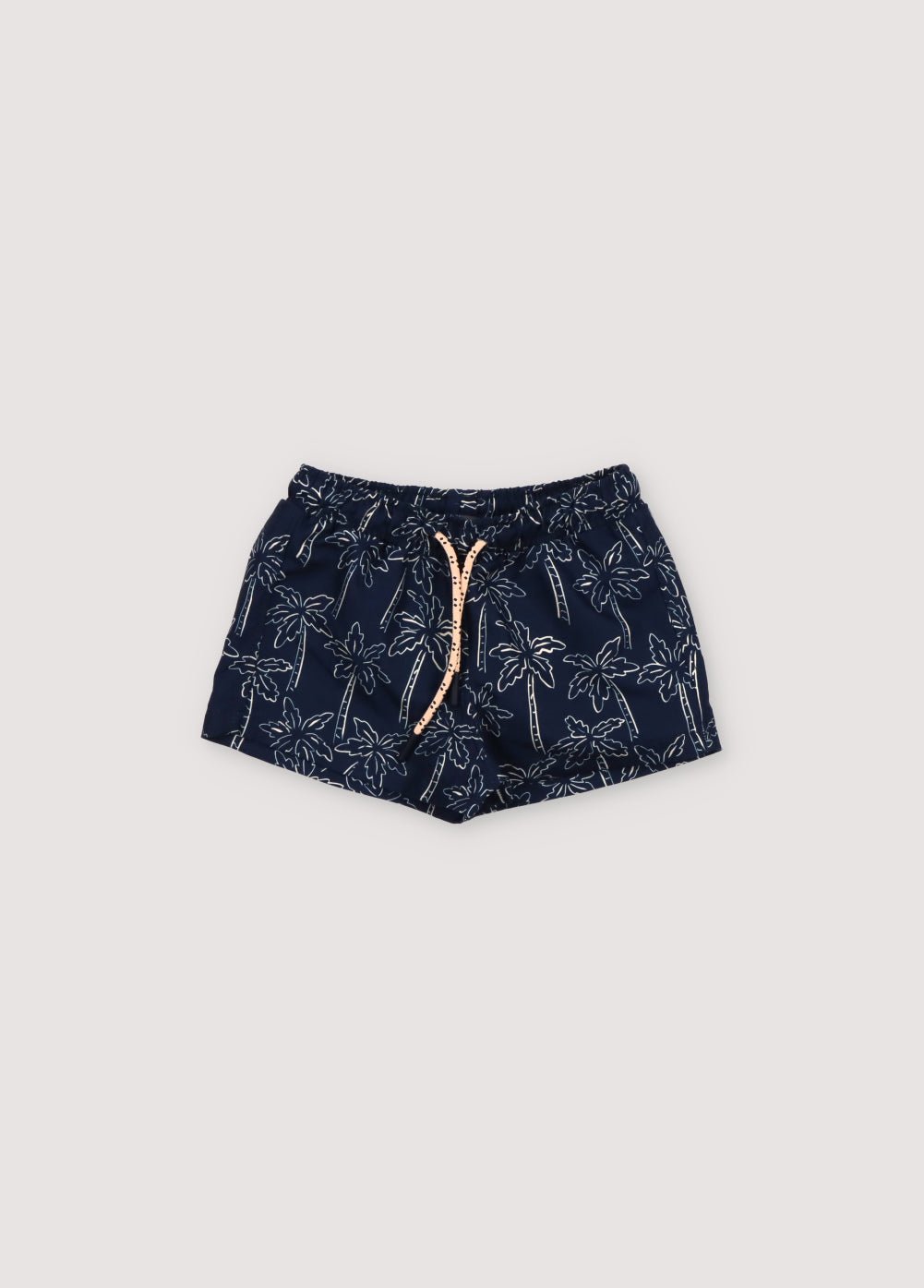 Maillot de bain à imprimé palmiers contrasté sur fond bleu marine, doté d'une taille élastique avec cordon de serrage réglable. Collection Printemps Été. The New Society.