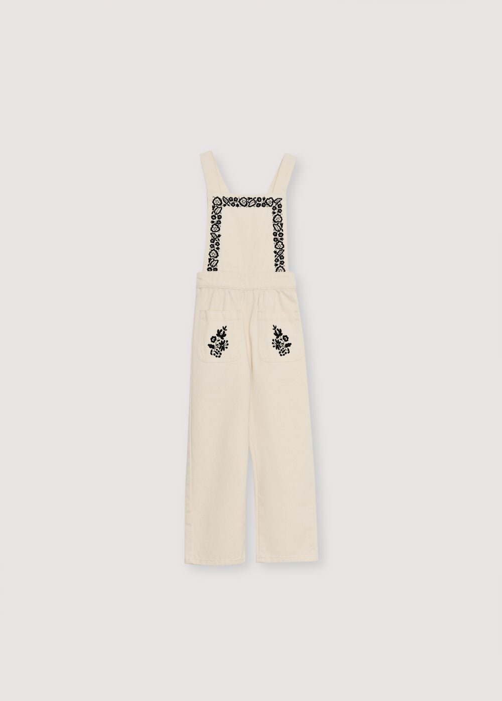Denim overall with contrast embroidery details on the upper front and two patch pockets in the front. It features an elastic waistband at the back and adjustable straps at the back.
