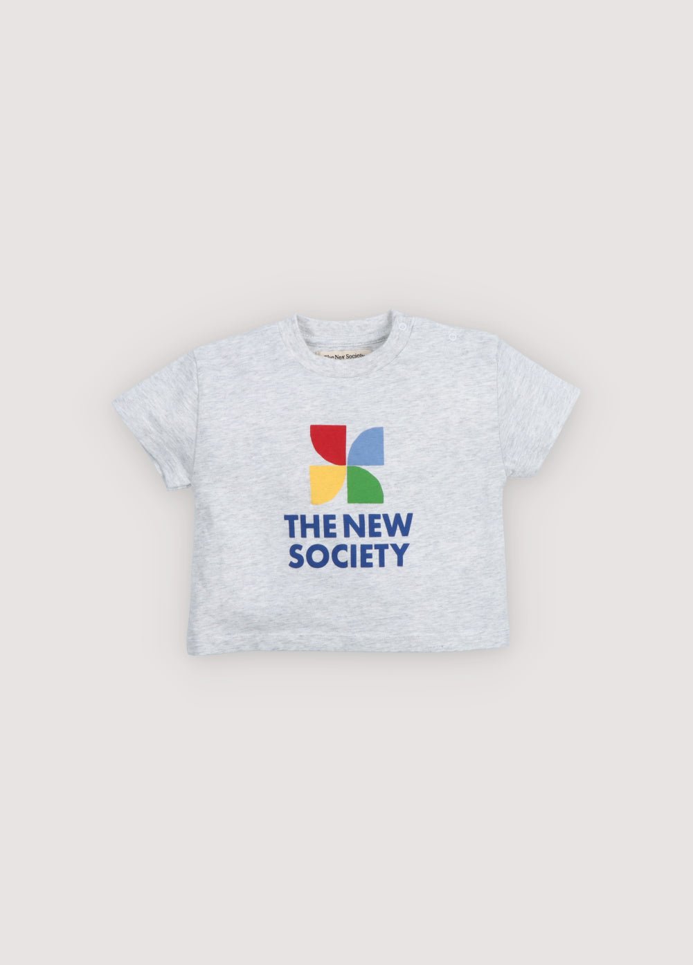 A soft cotton baby bodysuit featuring a delicate all-over heart print and a subtle logo detail on the front.