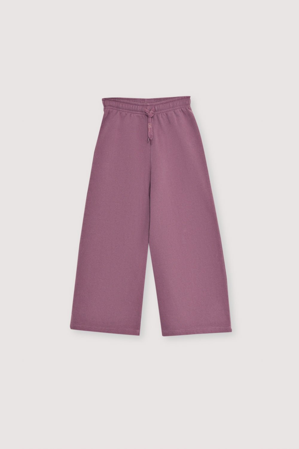 Fleece joggers brushed inside and outside  with a wide-leg fit and an elastic, adjustable waistband with a drawstring. Brushed on the inside and outside. It has an embroidery detail on lurex cord. 