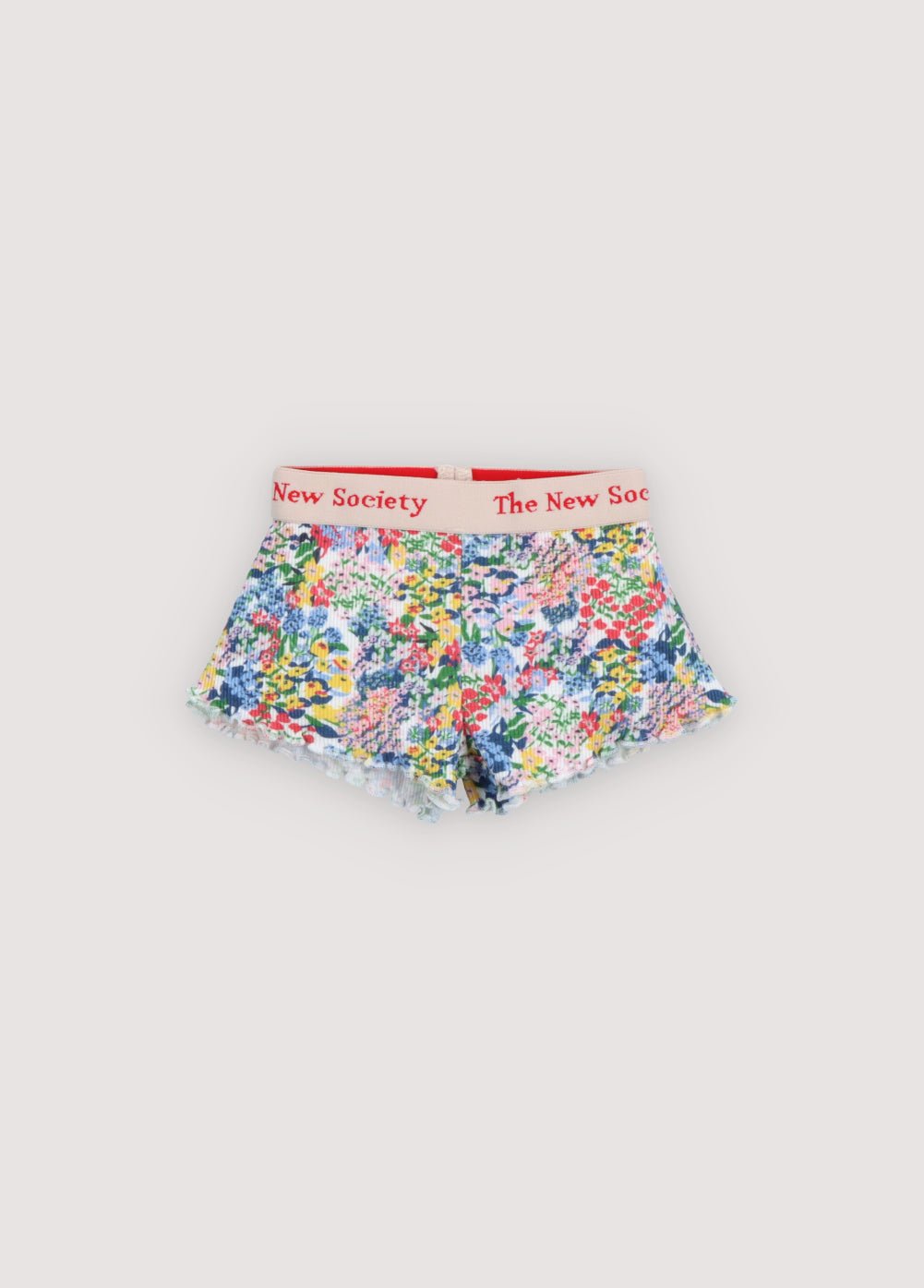 Soft rib cotton shorts featuring a colorful flower print and a baby overlock finish.