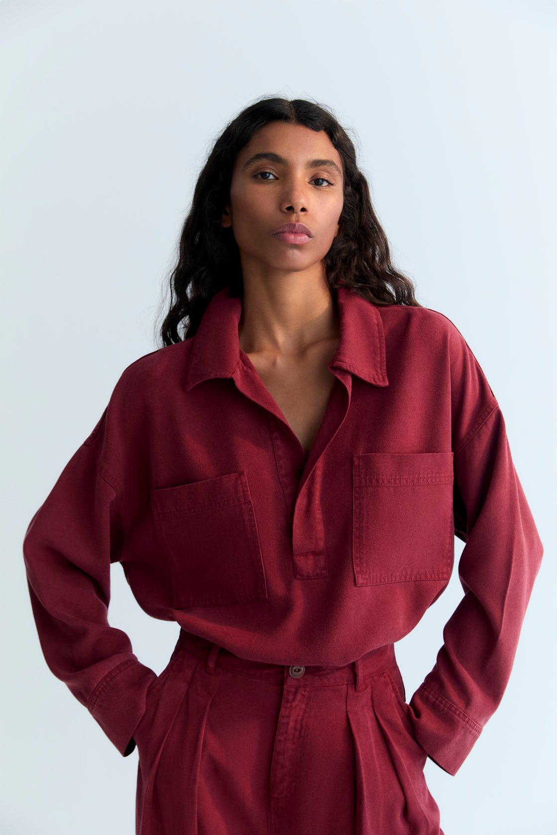 Our best seller shirt, made from Tencel fabric with an oversized fit, featuring a placket and two front patch pockets. It comes with matching trousers to complete the total look.