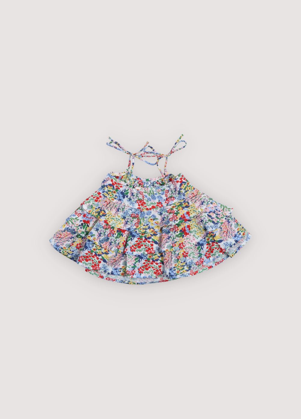 A sweet baby dress crafted in soft, lightweight cotton, featuring our delicate Verbena floral print. Designed with a flared silhouette and adjustable tie straps for a comfortable and charming fit.