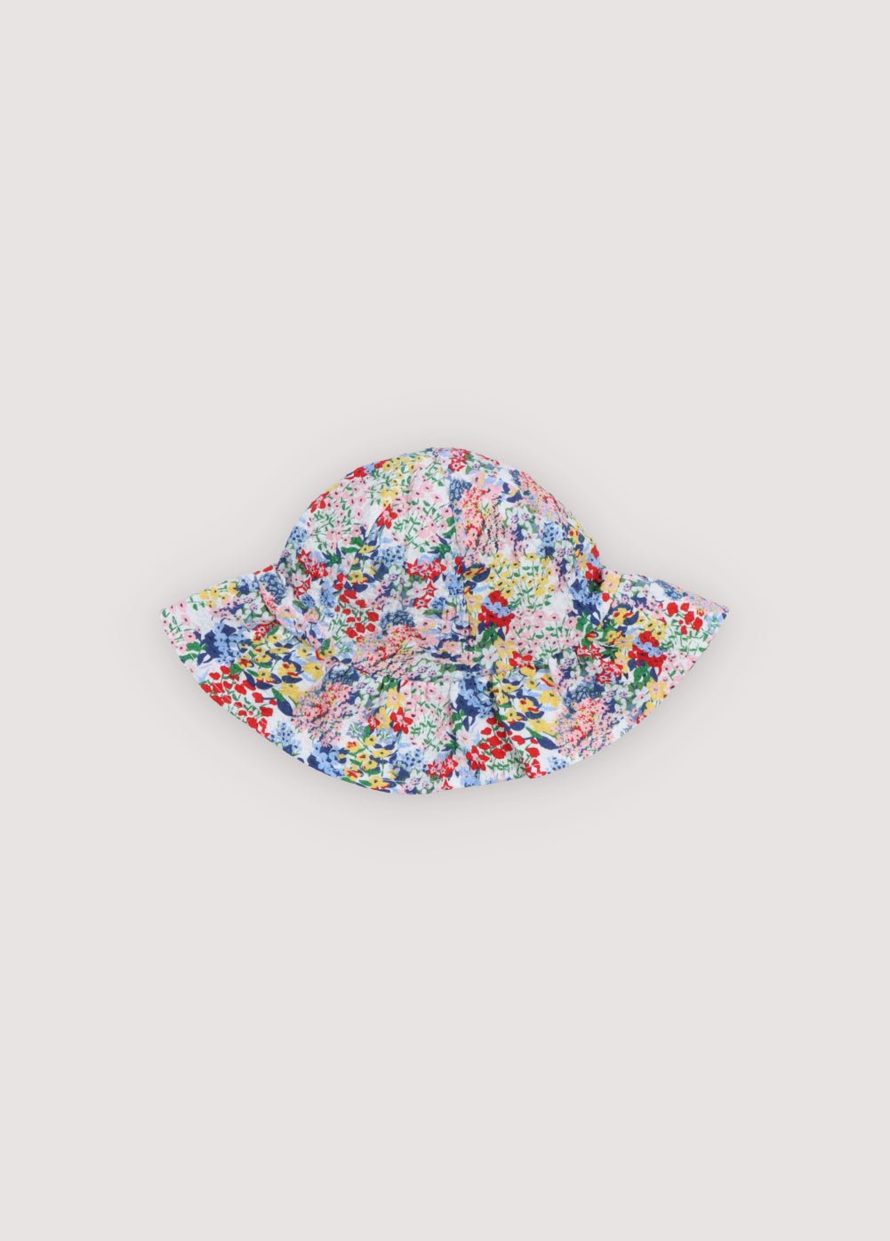 Baby cotton seersucker hat featuring a beautiful floral print and adjustable ties for a secure and comfortable fit.